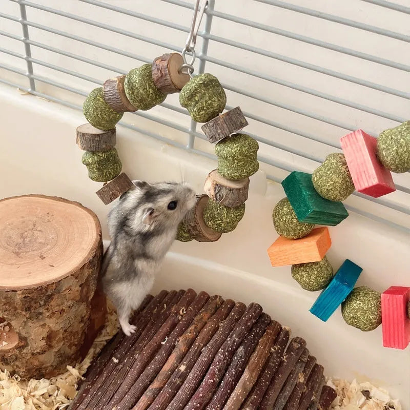 Decorative straw ball ring chew toy made from applewood for hamsters and small pets.