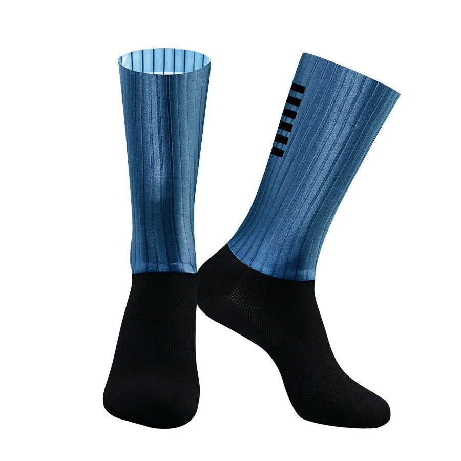 Pair of breathable chemical fibre blend athletic socks for cycling and running, shown in orange colour.