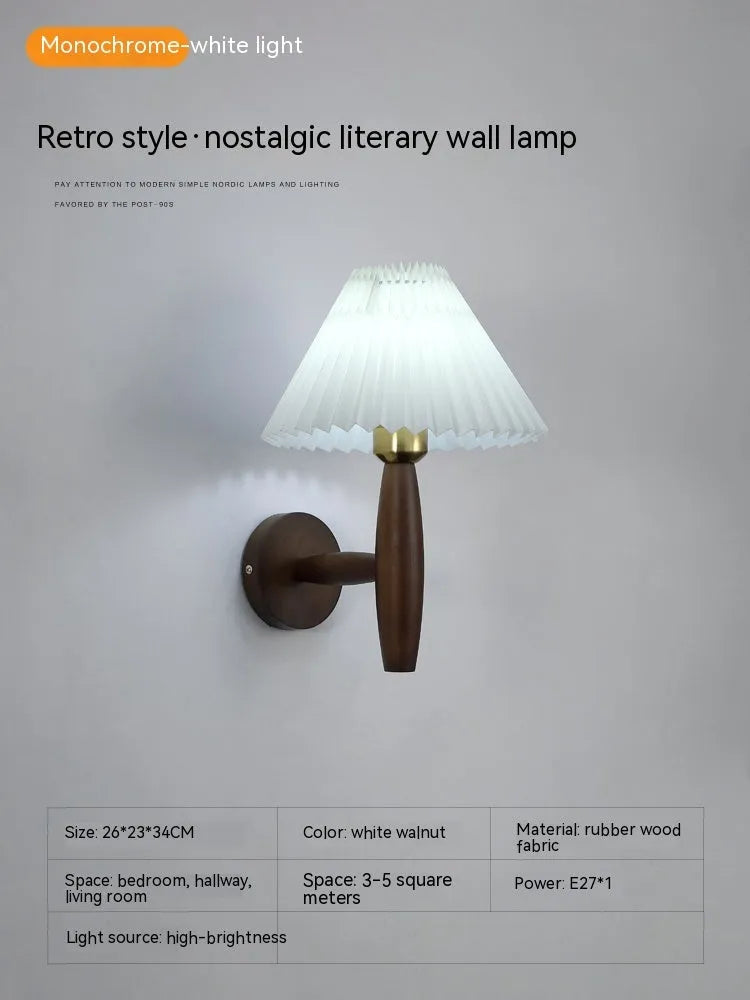 American retro style adjustable wall lamp in walnut wood with a fabric shade, mounted beside a bed.