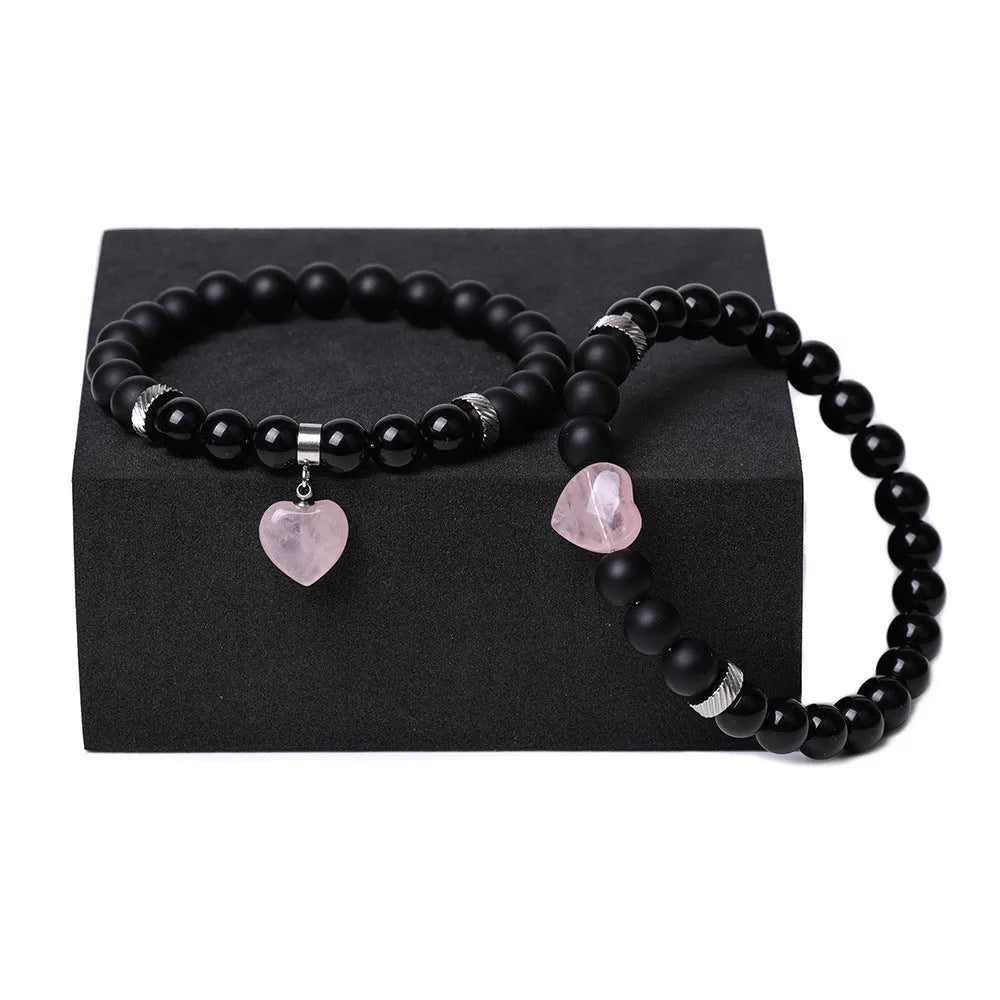 Natural stone couple bracelet set showing two matching bracelets with heart-shaped polished stone charms