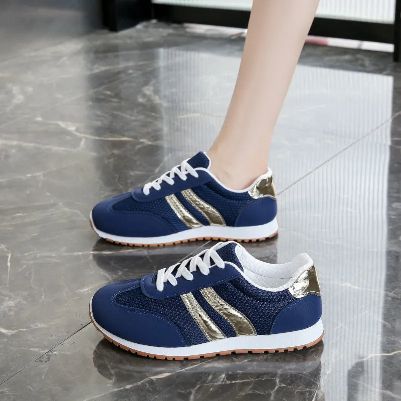 Blue women's casual sports shoes with cross shoulder straps and a lace-up front on a non-slip rubber sole.