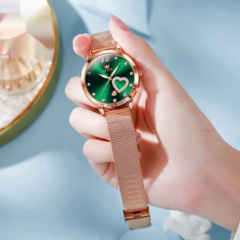 Women's mesh strap watch with rose shell casing showing six face colour options