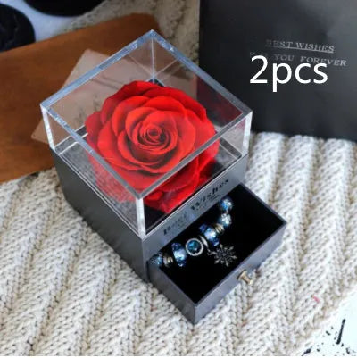 Eternal Flower gift box with preserved roses and carnations inside, measuring 8.5 cm square by 10.5 cm high