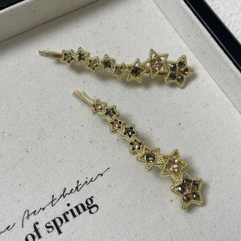 Gold-coloured rhinestone barrette clip with star charm for bangs