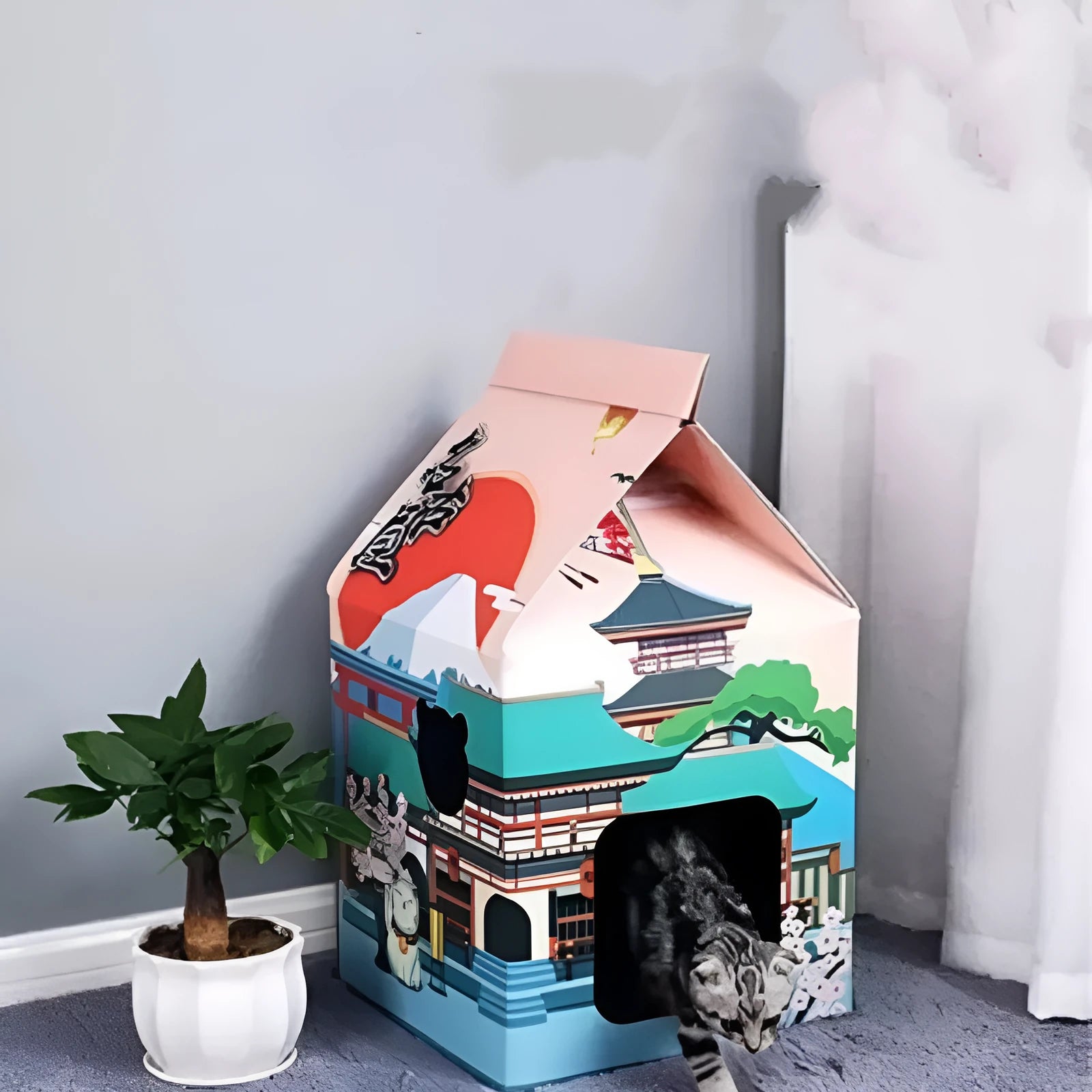Foldable corrugated paper cat scratching board with Nagoya cat design, shown as a pet toy.