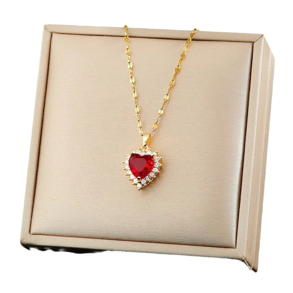 Gold red titanium steel jewellery set with heart flower pendant, matching earrings and ring