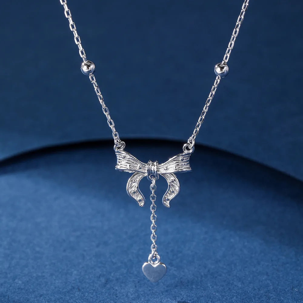 S925 silver necklace with heart and bow pendant on an O-ring chain