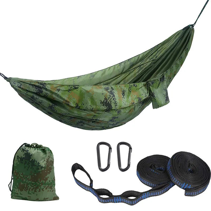 Double camping hammock with ropes and buckles shown in outdoor setting