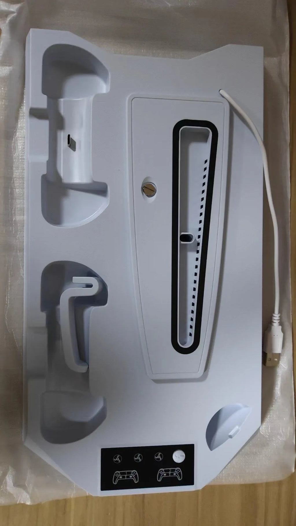 White PS5 charging base radiator with controller and headset storage compartments