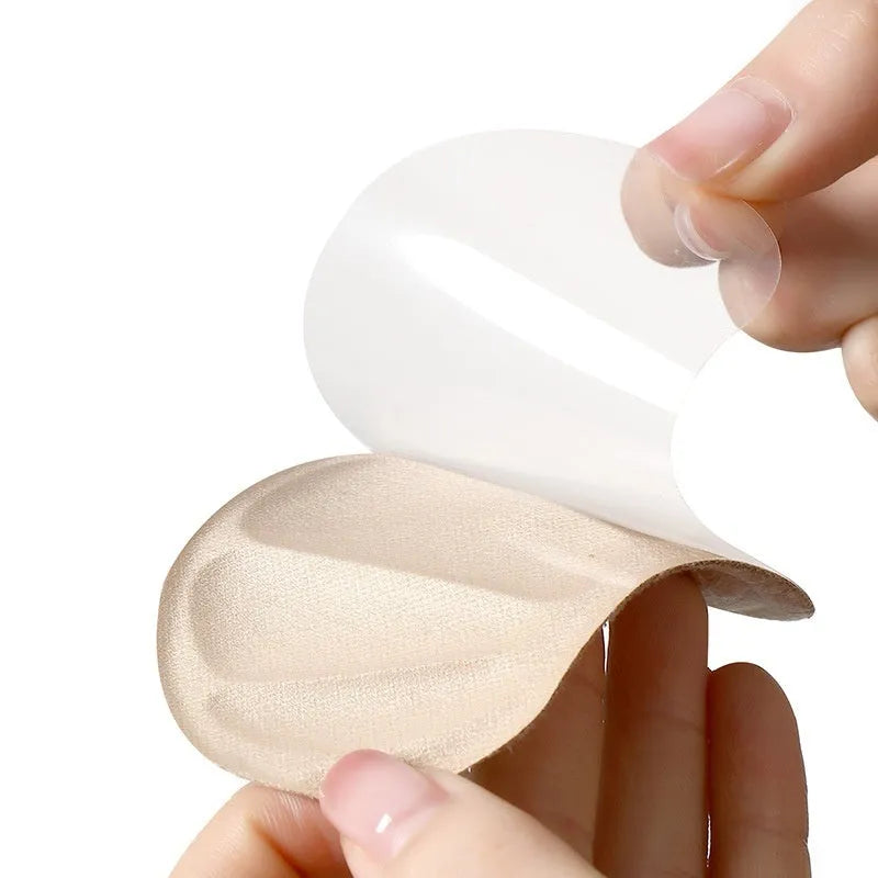 Three pairs of camel suede anti-slip heel cushion pads on a white background.