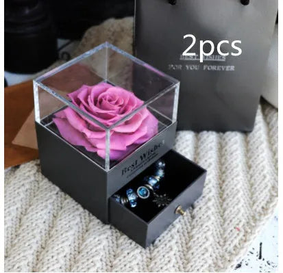 Eternal Flower gift box with preserved roses and carnations inside, measuring 8.5 cm square by 10.5 cm high