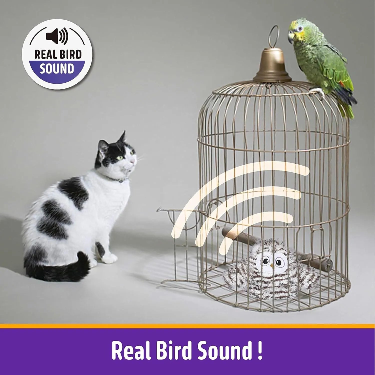 Grey owl-shaped automatic cat toy with flapping wings on a flat surface