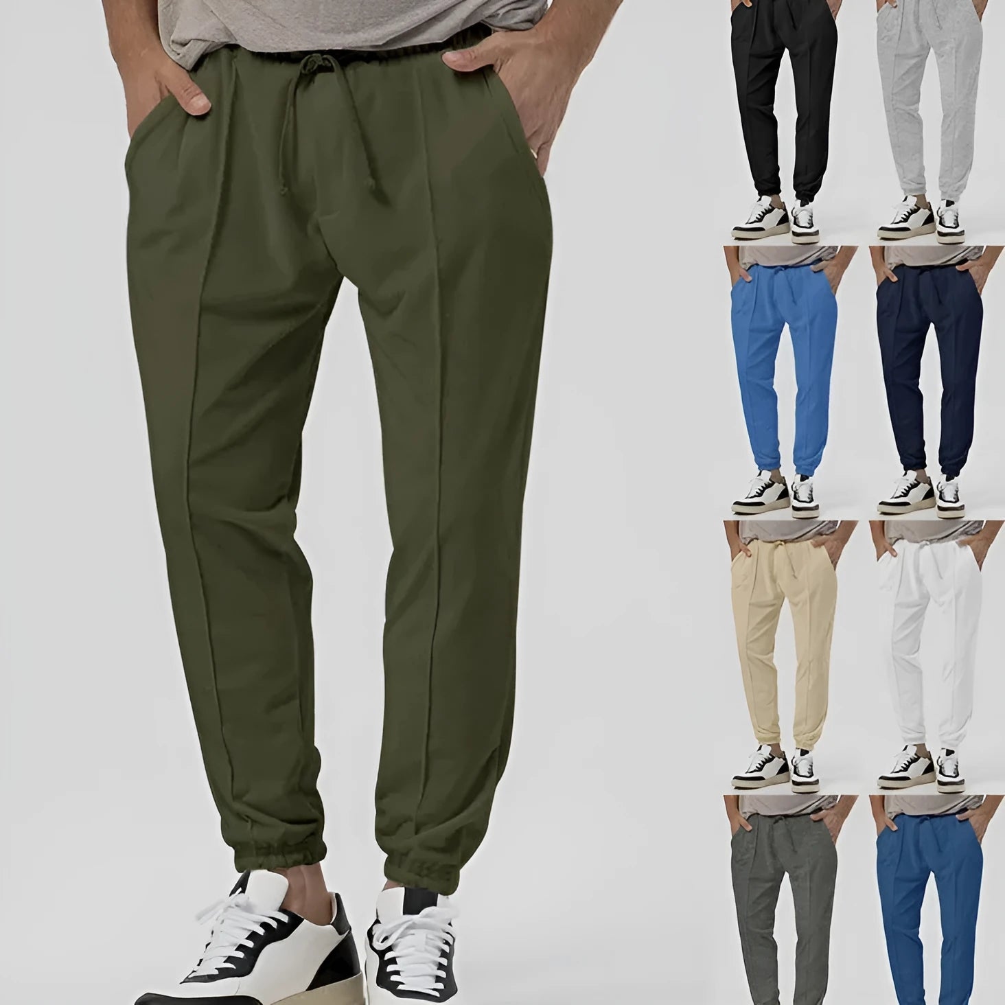 Men's grey track sweatpants with elastic waistband and straight-leg tapered fit