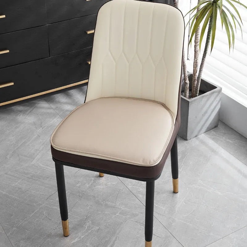 Leather horseshoe-shaped seat cushion in beige colour showing thickness and non-slip design