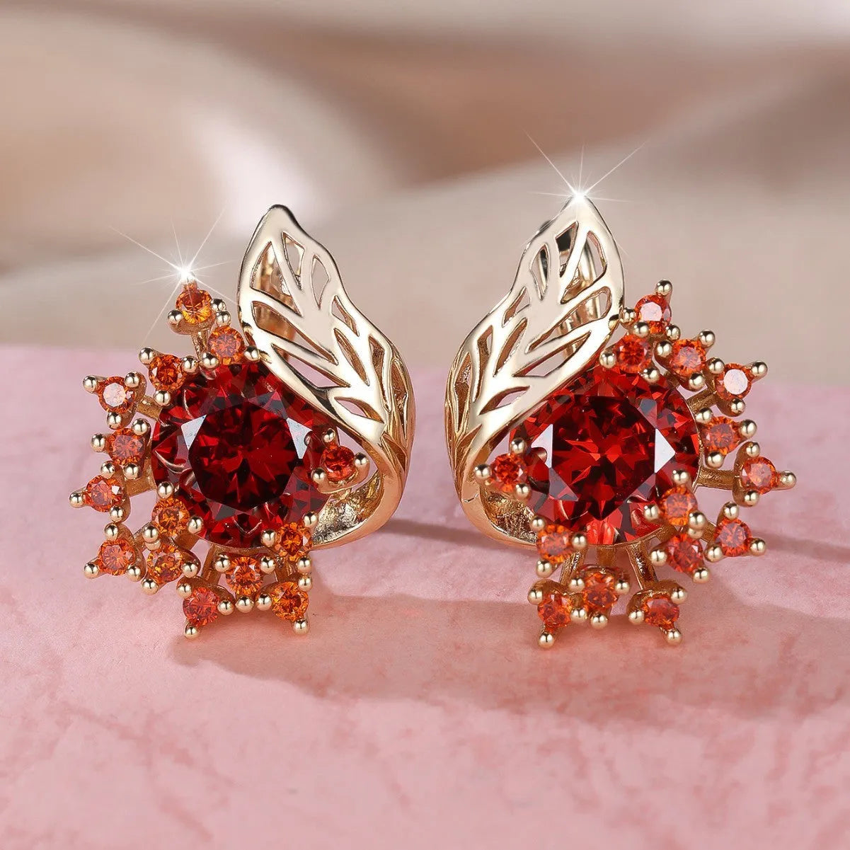Round floral feather earrings in rose gold colour with crystal zircon stones, shown in six colour variations