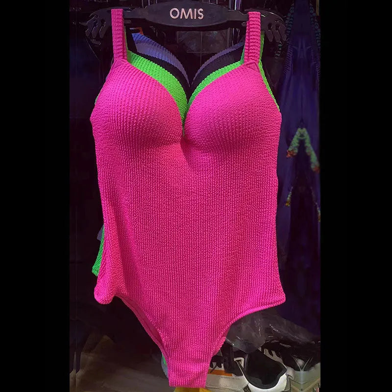 Women's sleeveless one-piece swimsuit with sunken stripe pattern in multiple colour options