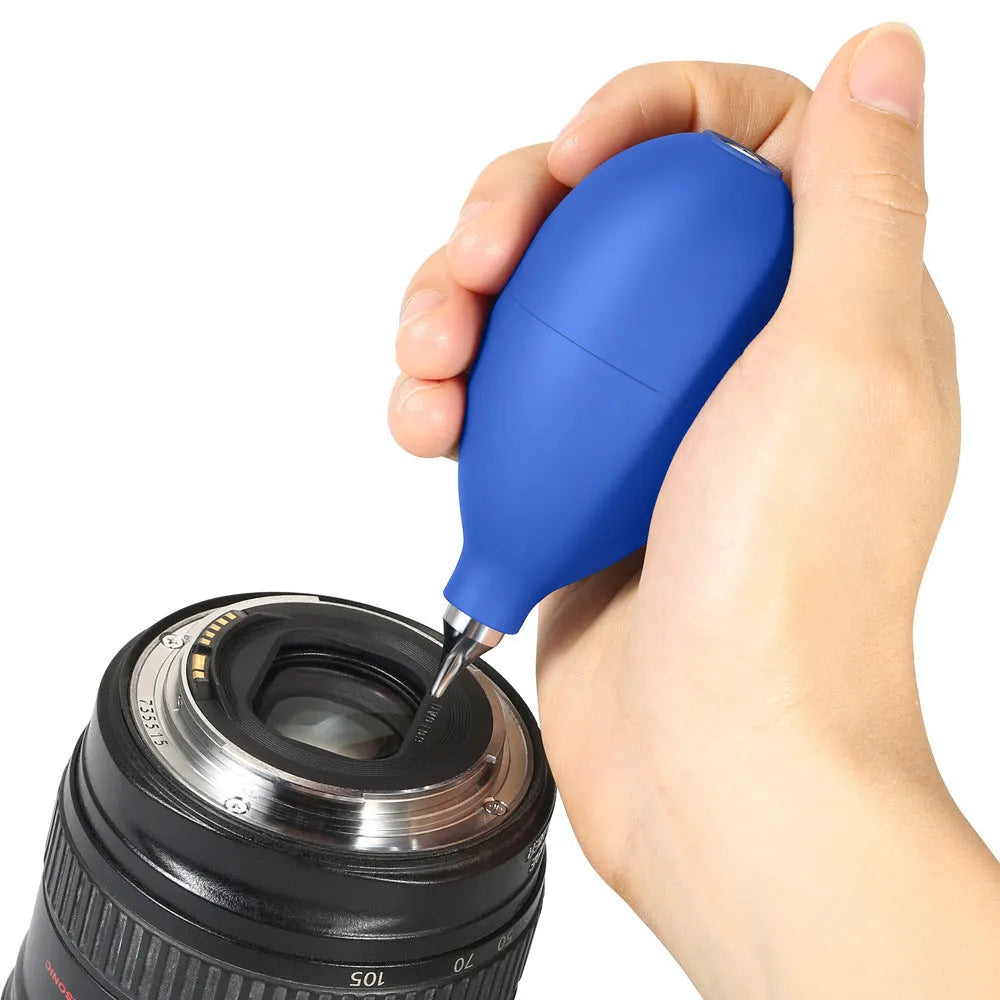 Blue and black rubber handheld dust removal ball for cleaning camera lenses and electronics.