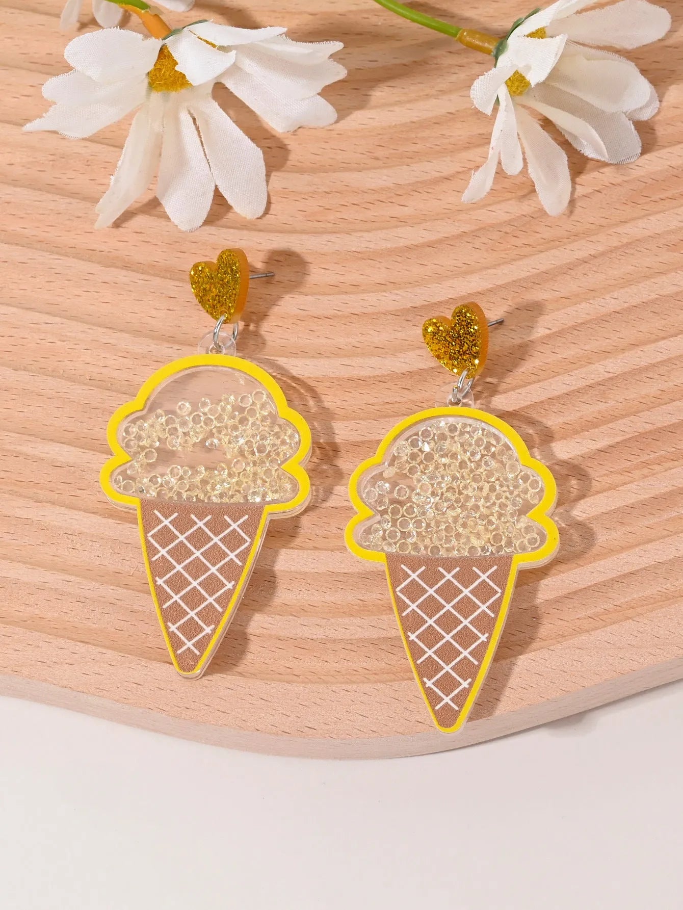 Colourful acrylic fruit and ice cream dangle earrings for women on a white background.