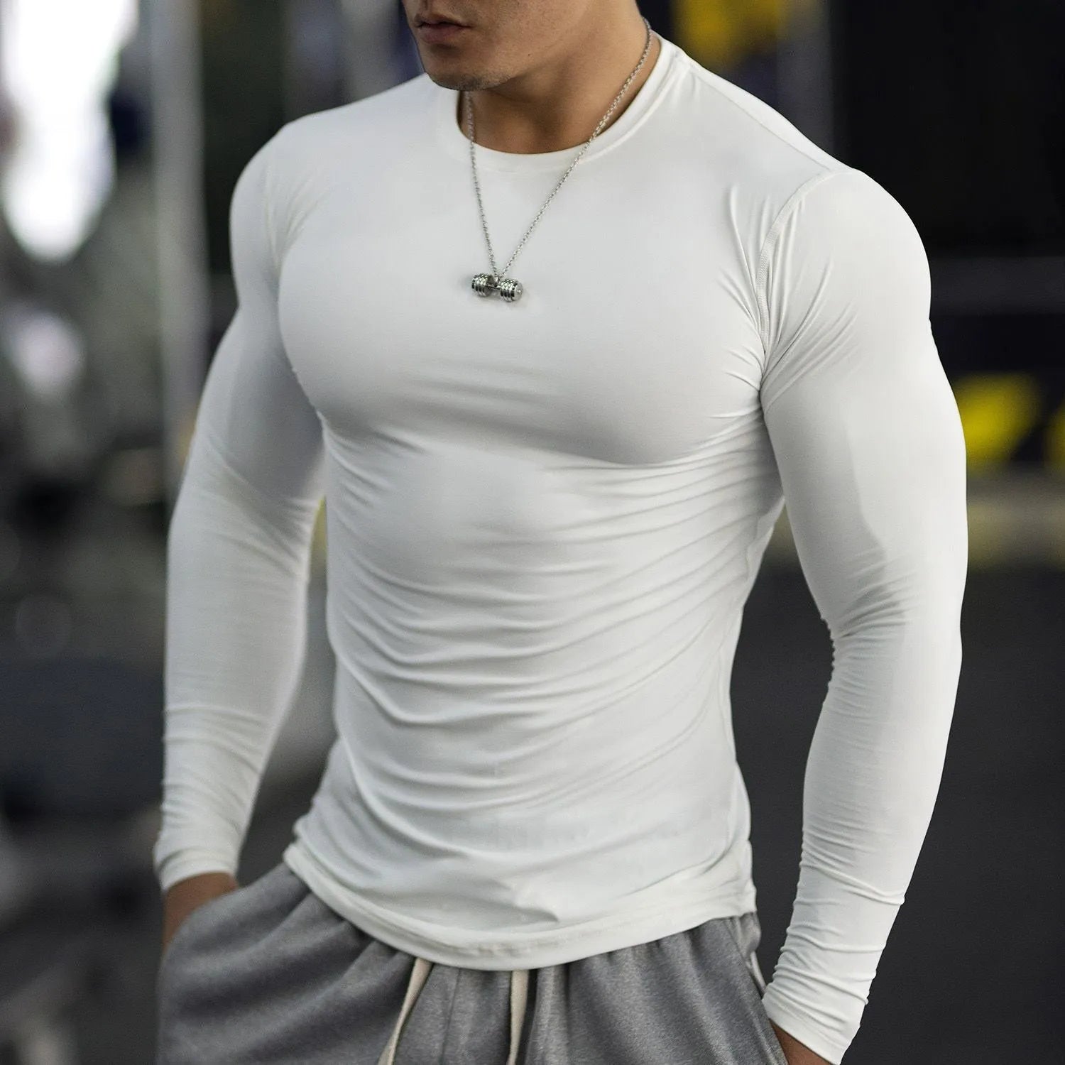 Men's black long-sleeved slim fit fitness tights for running and gym workouts