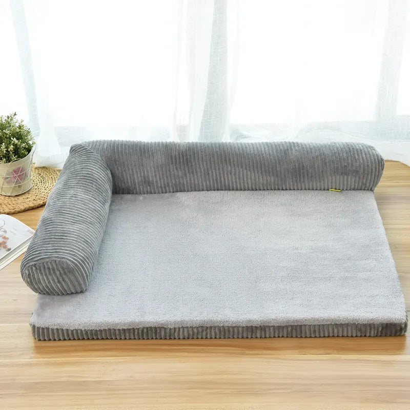 Corduroy bolster dog bed in grey, showing bilateral raised sides and non-slip base.