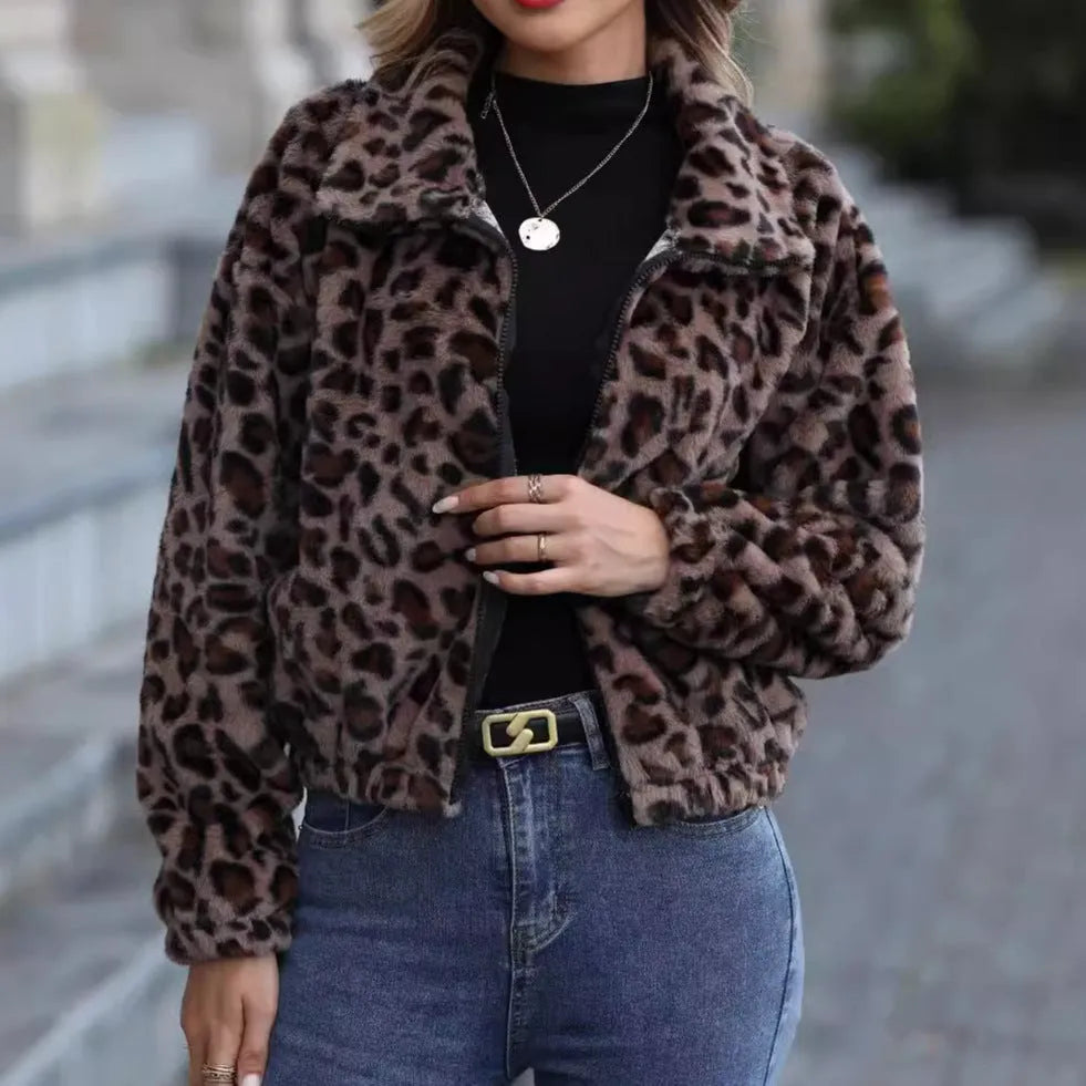 Women's loose-fit leopard print plush coat with a zip front and raglan sleeves laid flat.