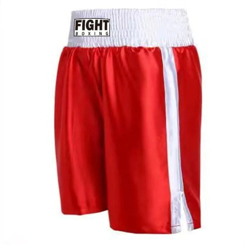 Man wearing black and white striped elastic waist kickboxing shorts in a training stance.