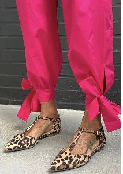 Leopard print women's pumps with pointed toe and low chunky heel on rubber sole