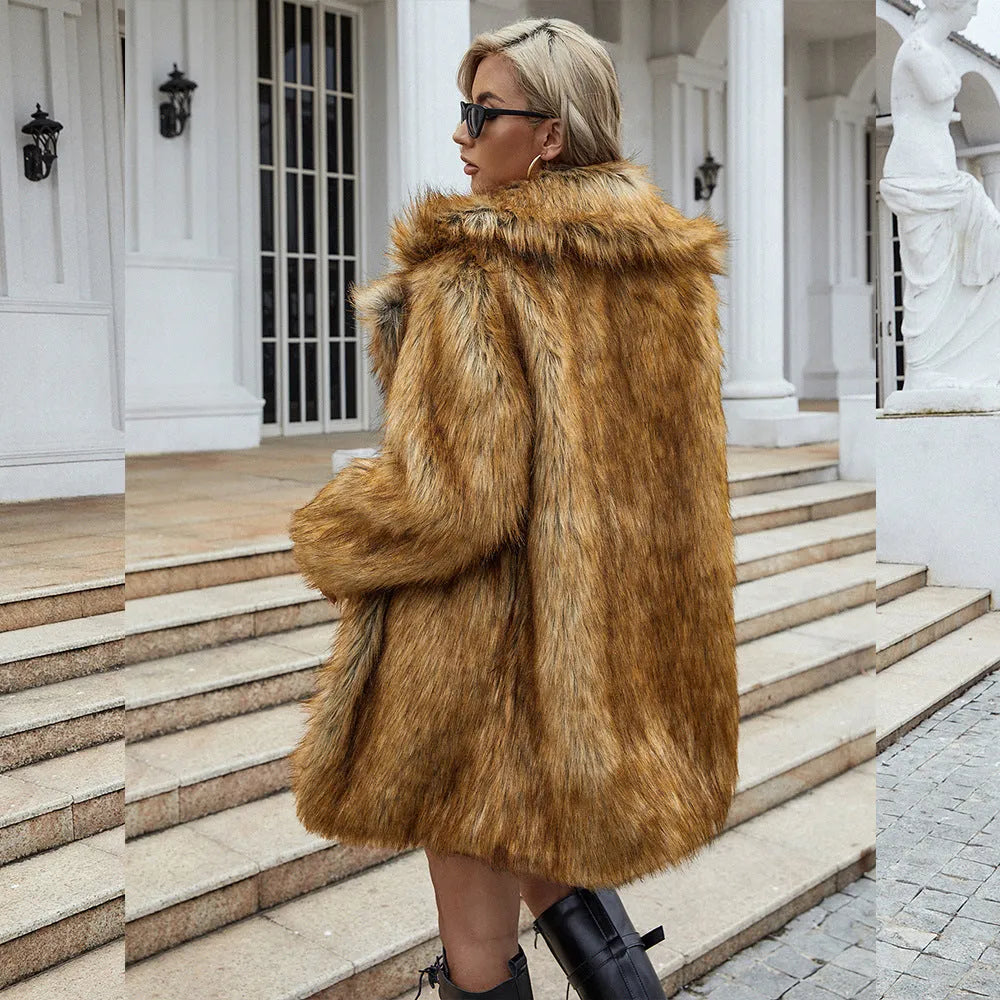Yellow loose-fitting women's faux fur coat on a hanger, showing regular sleeves and a plush texture.