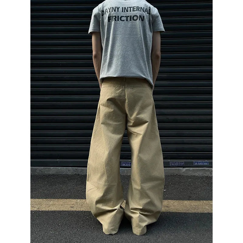 Men's khaki coloured straight-leg cotton casual trousers laid flat, showcasing the retro style and solid colour.
