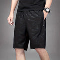 Men's loose-fitting polyester sports shorts in black, grey or blue colours
