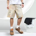 Light blue men's denim shorts with distressed wash and straight-leg silhouette