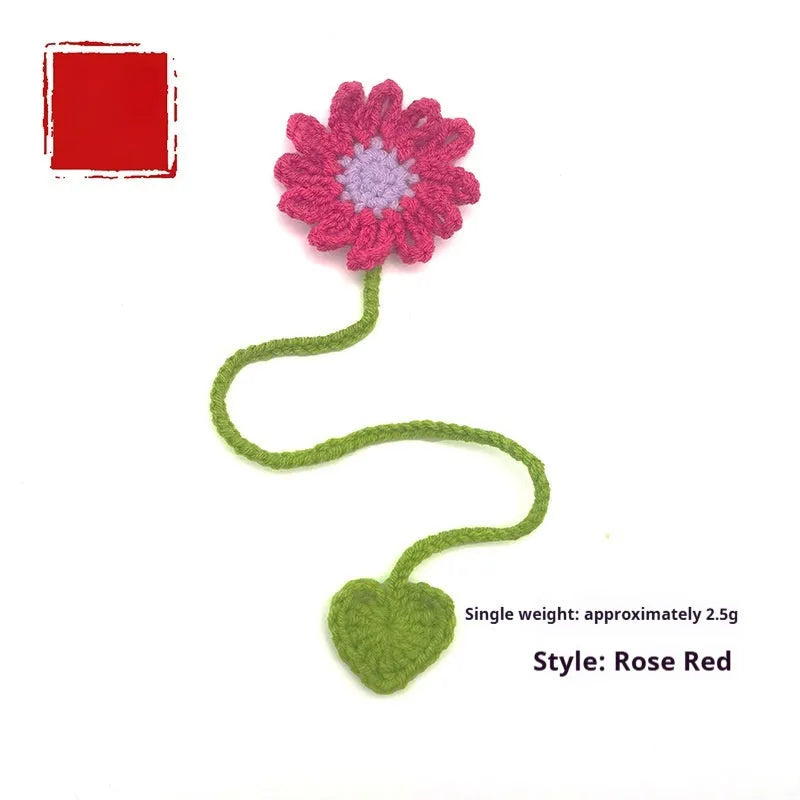 Hand-crocheted wool bookmark with flexible wire core and little daisy design in milk cotton yarn