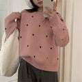Women's loose fit acrylic pullover sweater with embroidered love pattern in milky white.