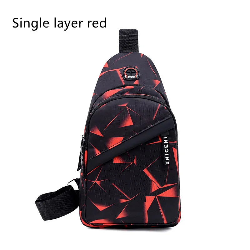 Men's blue Oxford cloth crossbody sling bag with earphone hole design showing zipper opening and letter print detail