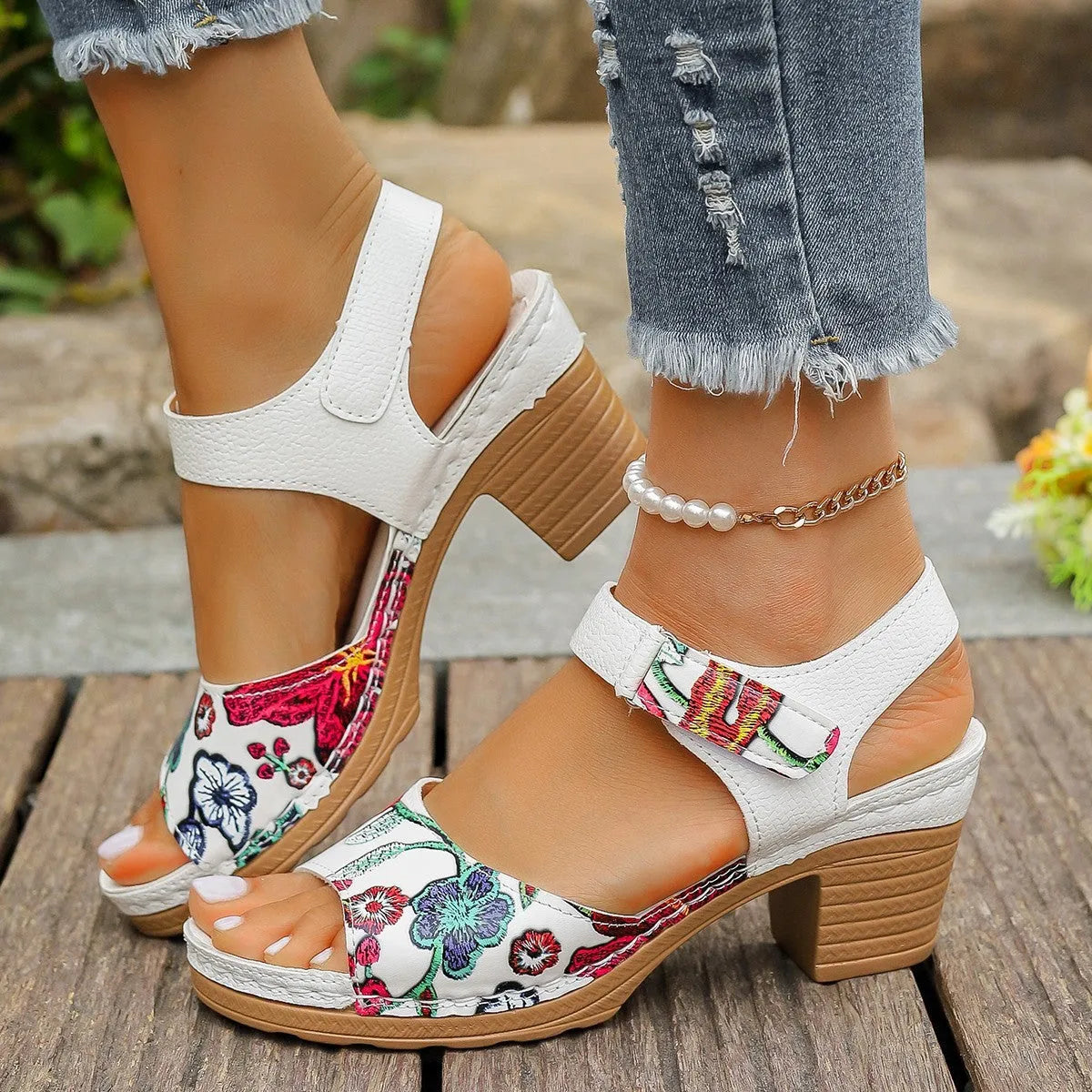 White women's casual high heel sandals with a prominent Velcro strap buckle closure.