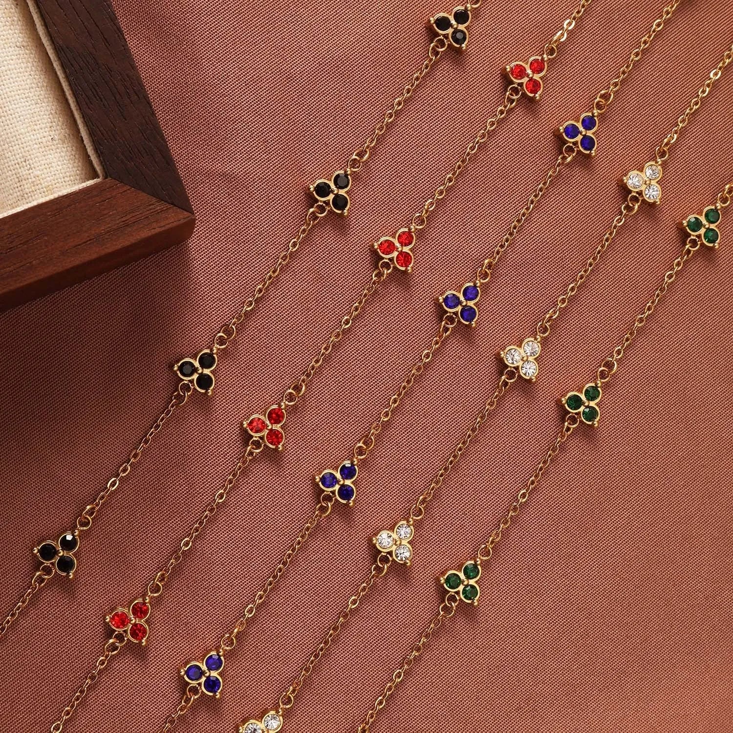 Women's stainless steel bracelet with three geometric diamond designs in various colour options