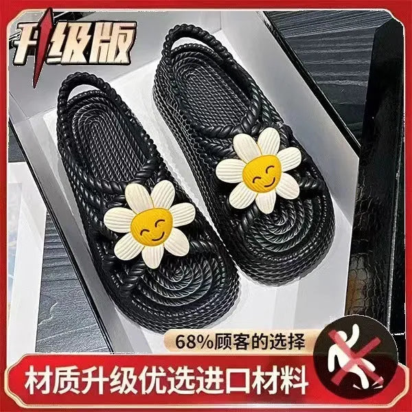 Beige PVC sandals with sunflower pattern and round toe on a non-slip sole.