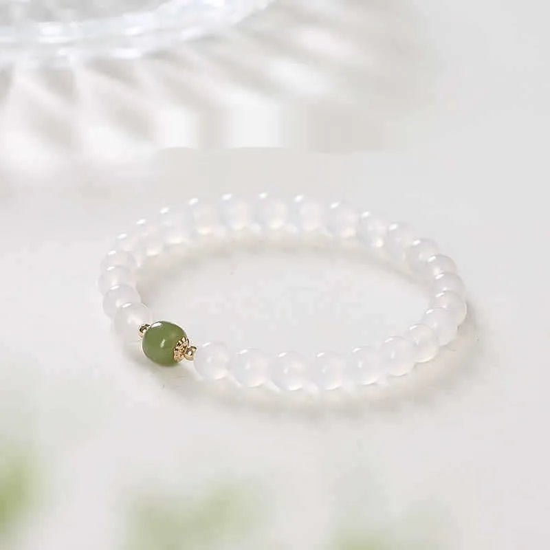 Handmade white agate bracelet with Hetian Jade and Cinnabar inlays showing 6mm and 8mm bead options