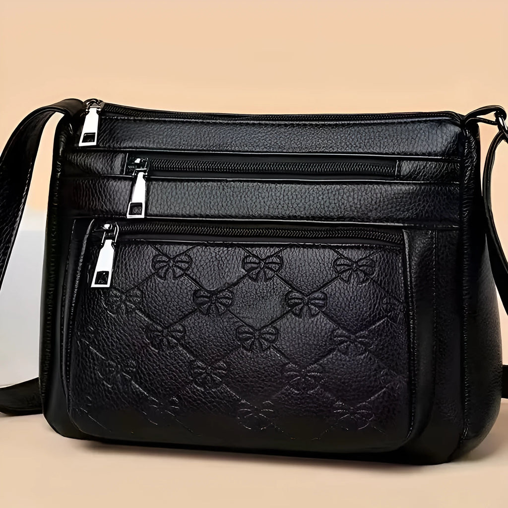 Butterfly black PU leather women's crossbody messenger bag with embossed design and horizontal square shape