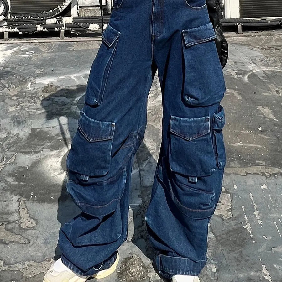 Dark blue wide-leg jeans with distressed detailing, high waist, and multiple pockets on mannequin