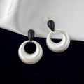 Retro geometric drop earrings with enamel colour clash in copper oil drop finish