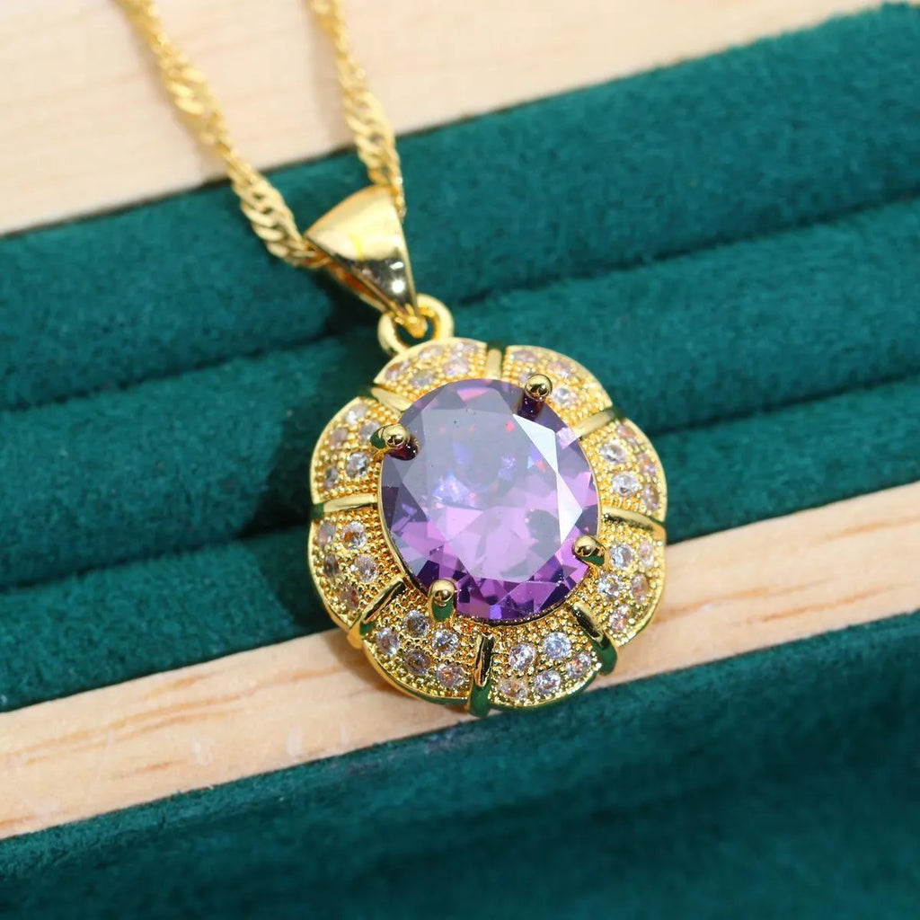 18k gold plated jewellery set showing necklace, earrings, ring and bracelet with coloured cubic zirconia stones.