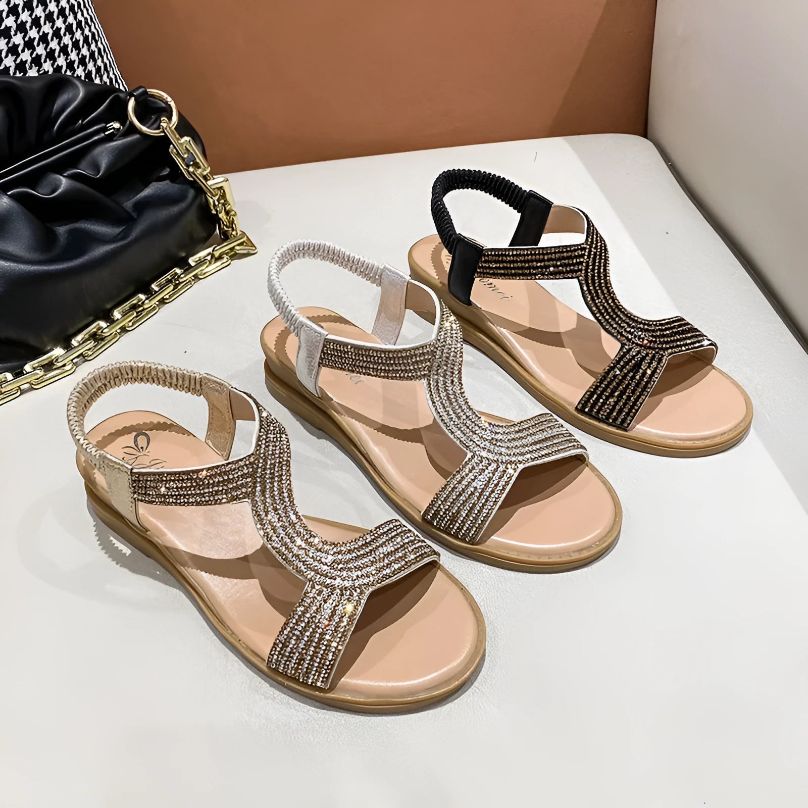 Gold women's patent leather sandals with rhinestone decoration and a non-slip sole.