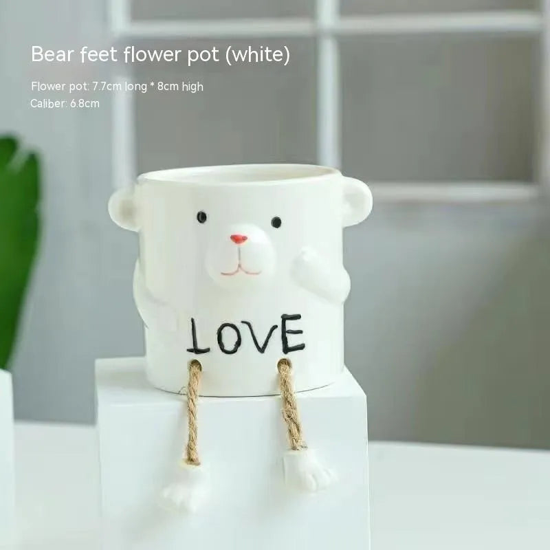 Ceramic hanging foot flowerpot in a cartoon style for desktop succulents.