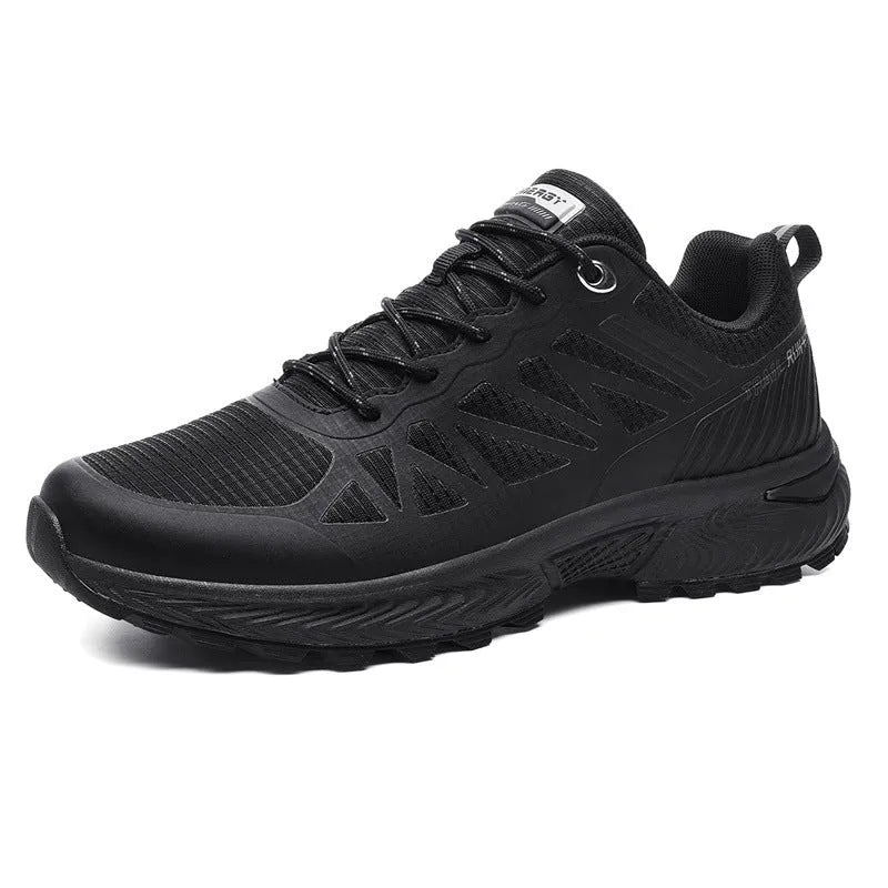 Men's black and orange breathable mesh running shoe with lace-up front and rubber sole