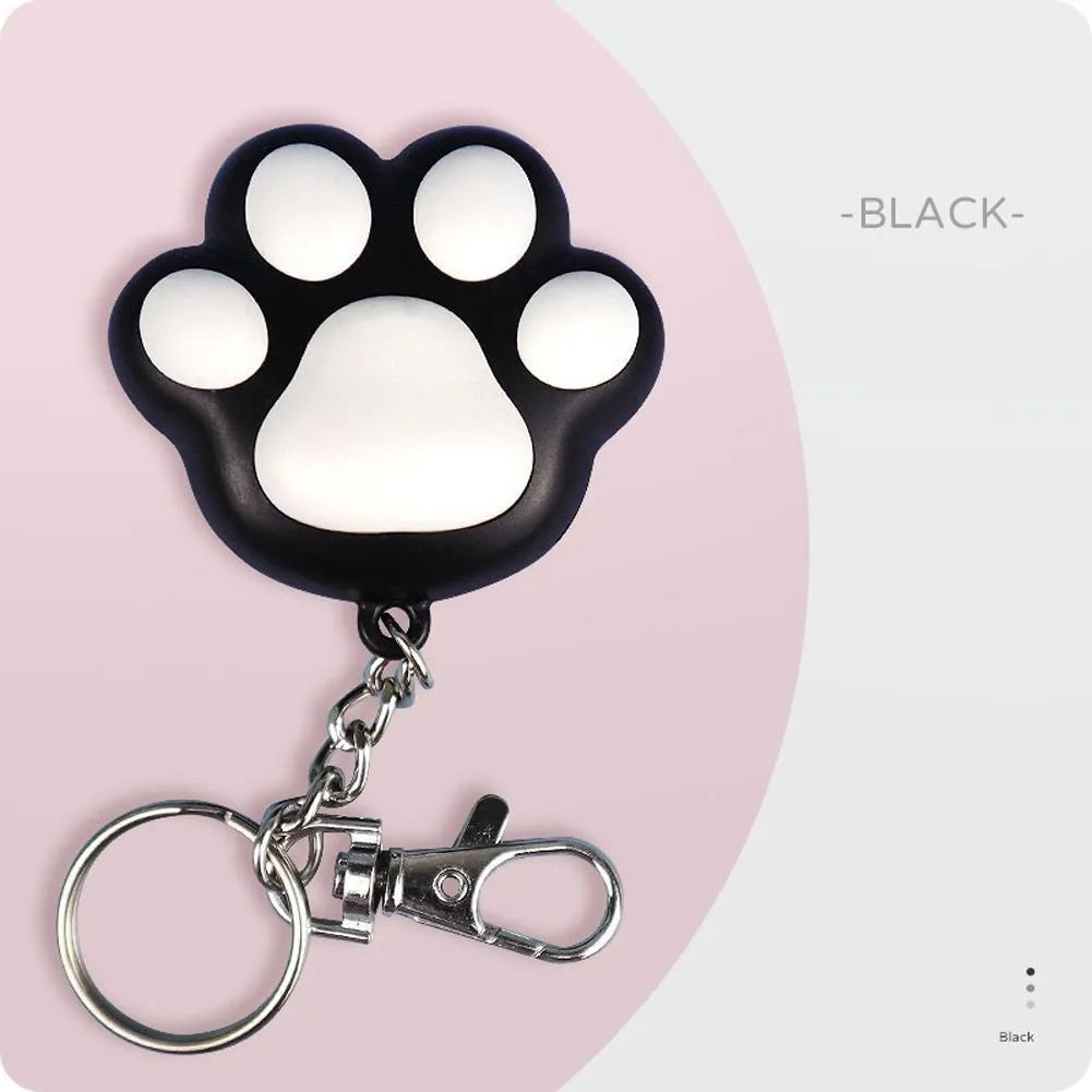 Pink and black plastic USB rechargeable infrared cat teaser toy on a keyring