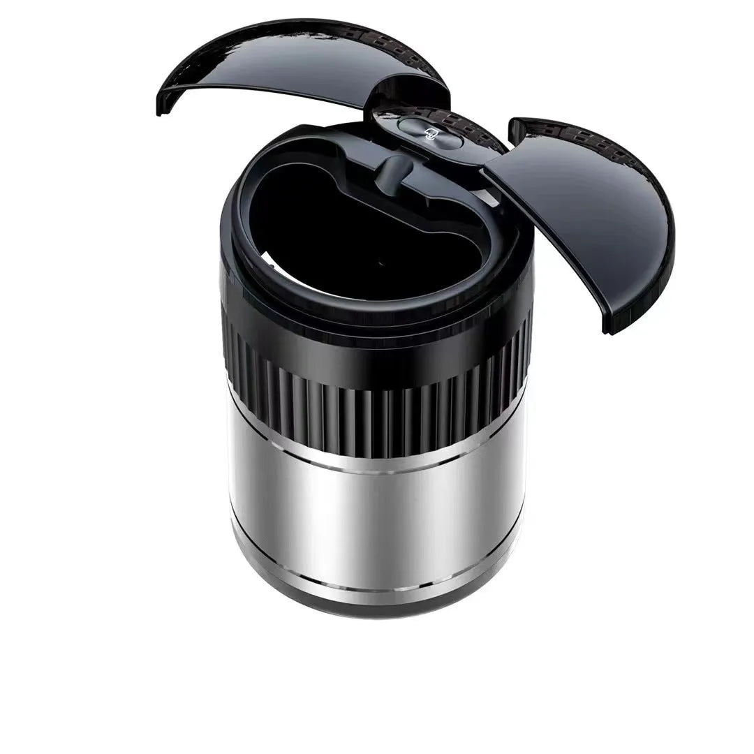 Black automatic infrared sensing metal car ashtray with lid on a car dashboard.