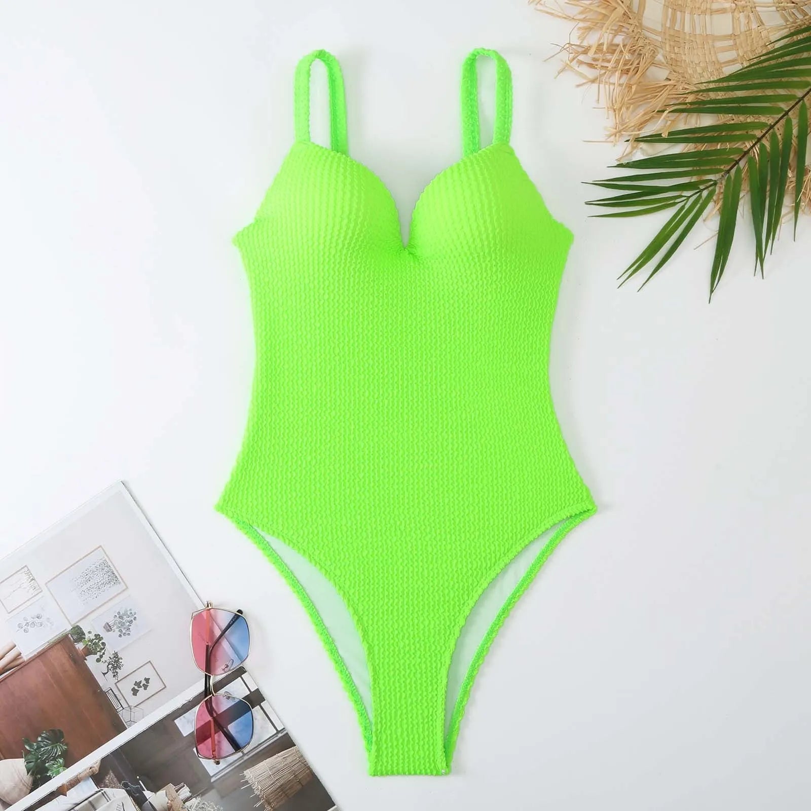 Women's sleeveless one-piece swimsuit with sunken stripe pattern in multiple colour options
