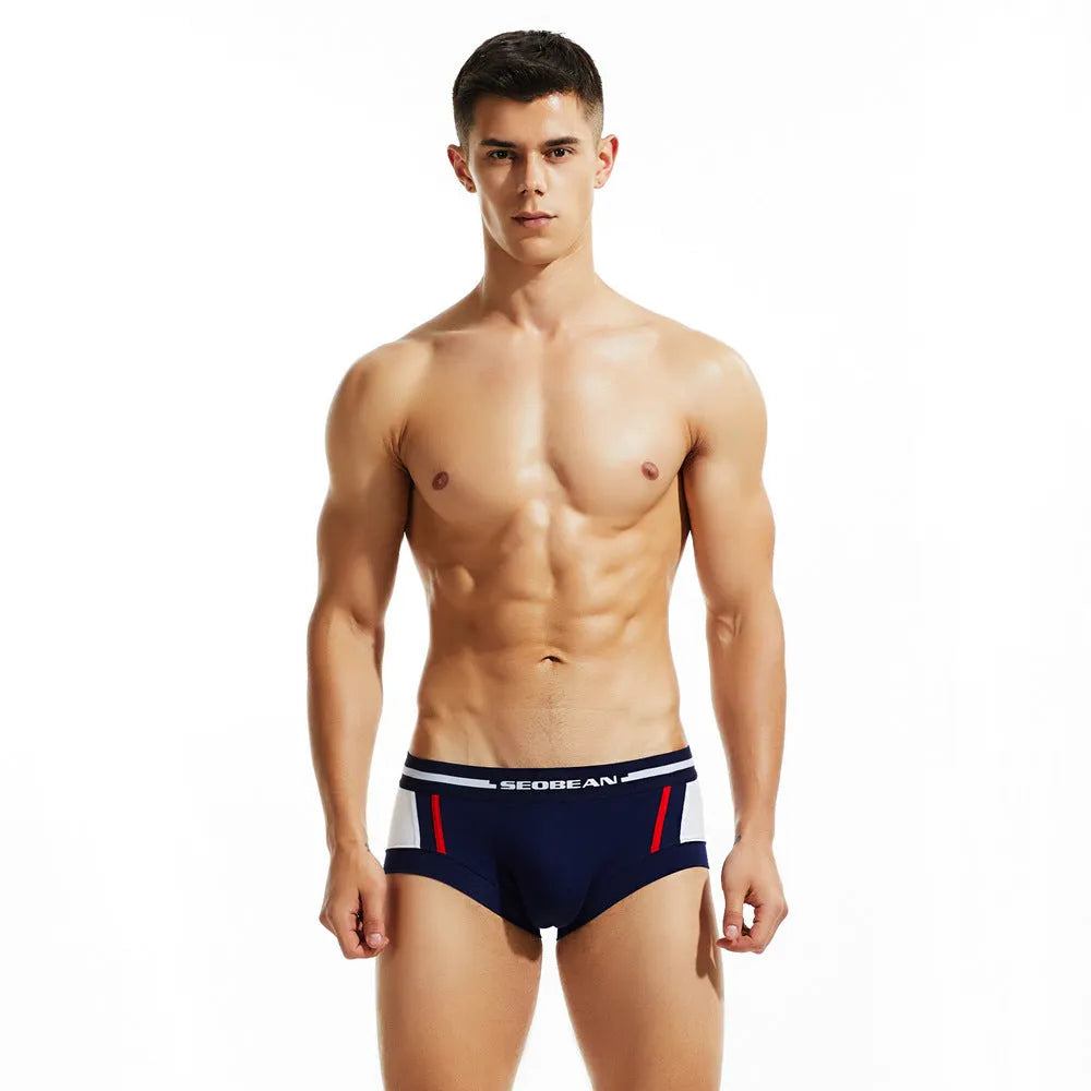 Men's cotton boxer shorts in red, dark blue, and light grey showing low waist design.