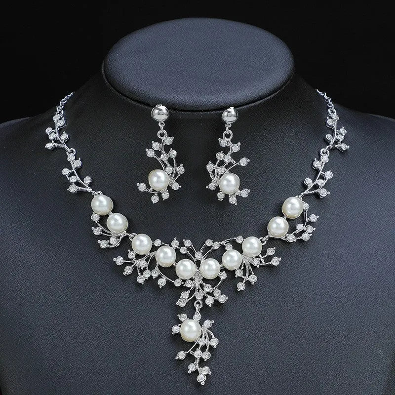 Women's fashion necklace and earrings set in gold or white with alloy construction and floral pattern